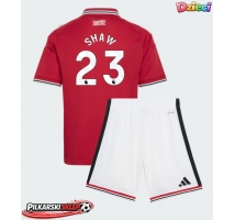 Manchester United Luke Shaw #23 Koszulka Podstawowa dzieci 2026-27 Krótki Rękaw (+ krótkie spodenki)